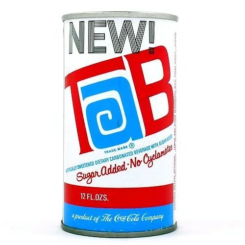 A TaB can in white with red and blue stripes, stamped NEW! above the logo and reading Sugar Added, No Cyclamates.