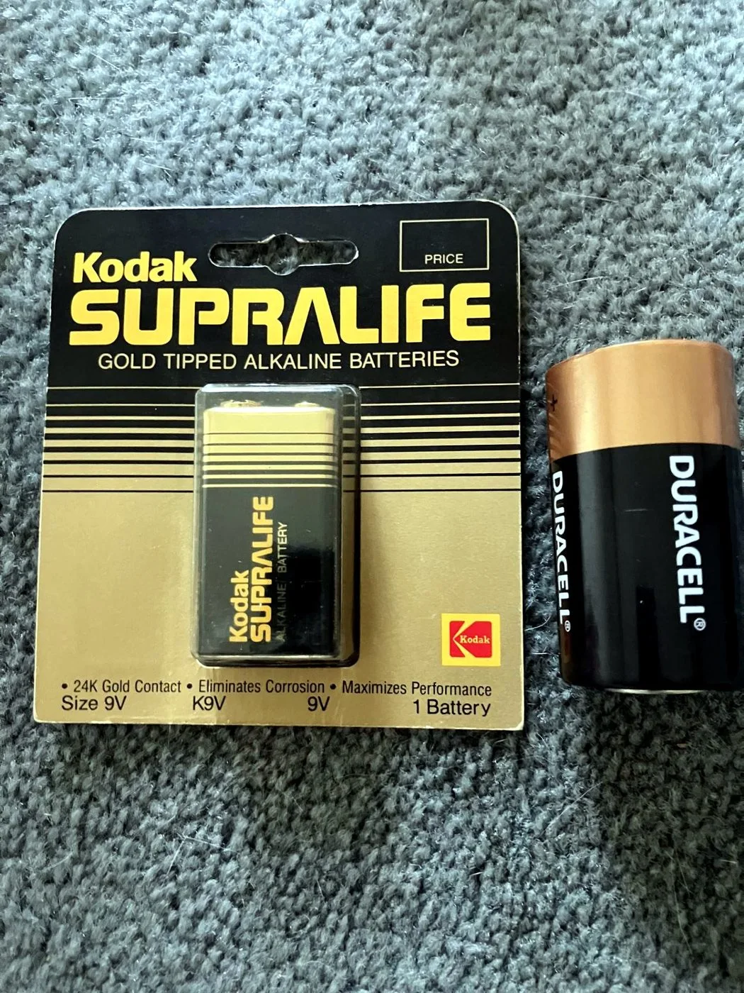 A Kodak Supralife battery package designed by Knut Simonson, shown beside a modern Duracell package for scale.