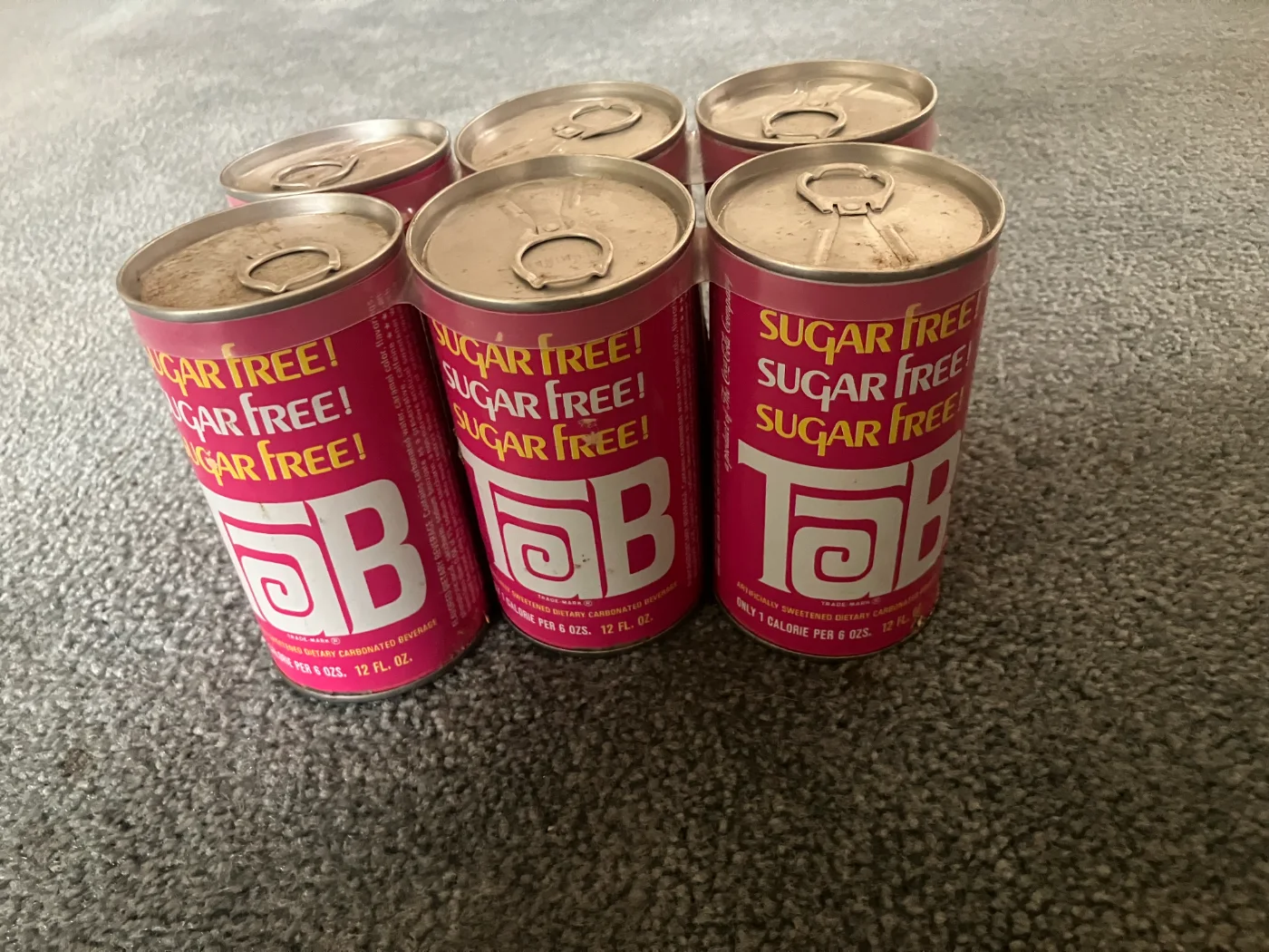 A six-pack of pink TaB cans, a hand-built prototype mockup from Knut Simonson's collection.
