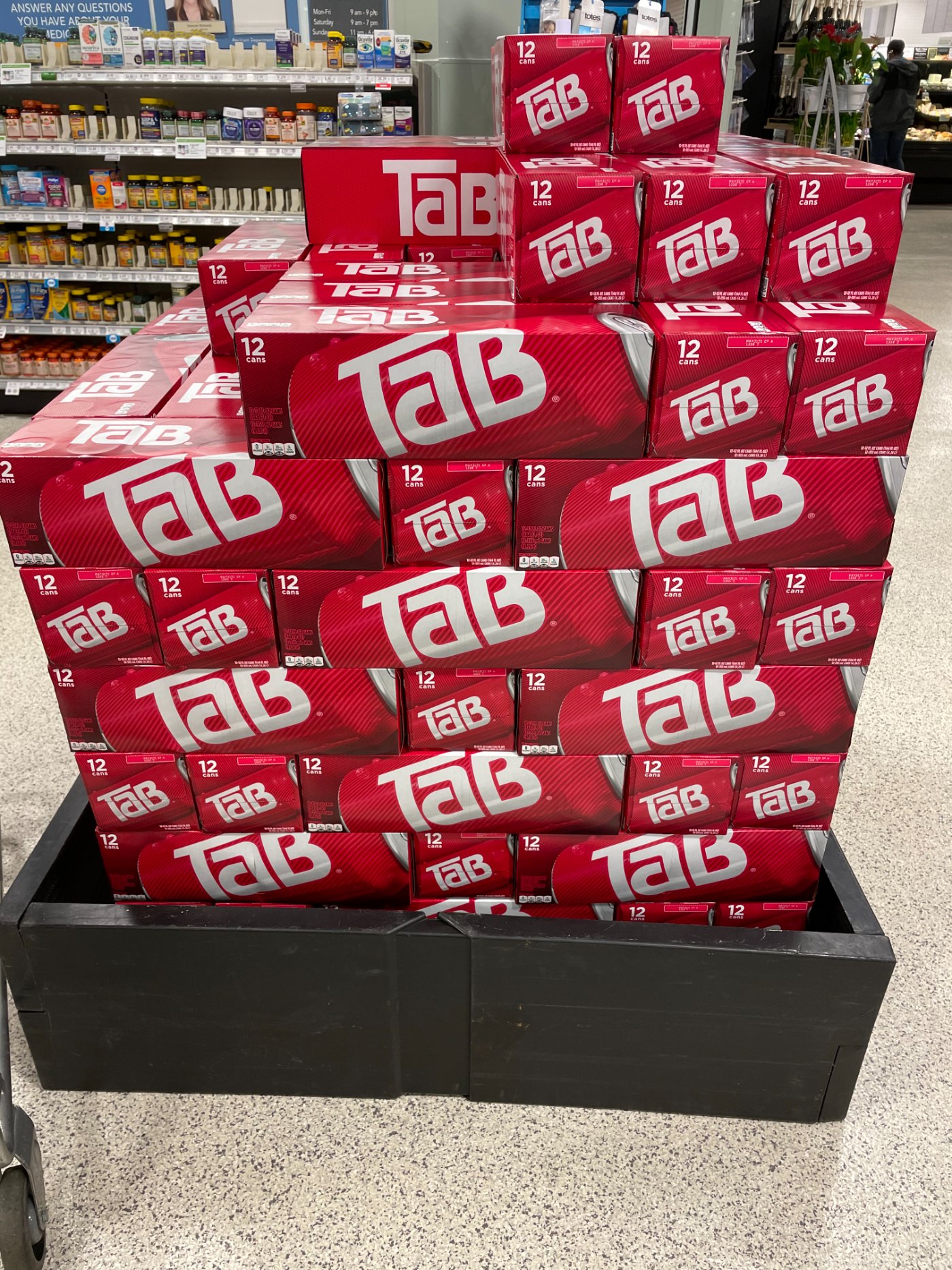 A towering store display of 12-can TaB cases